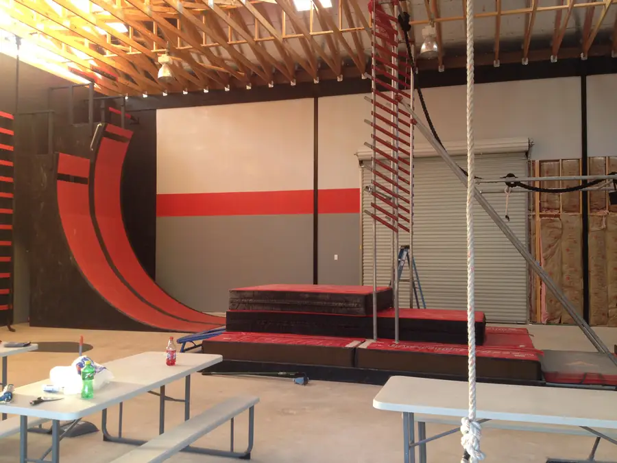 Painted interior walls and ramp of an indoor ninja warrior training facility in San Antonio
